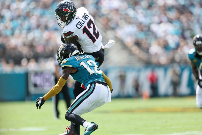 Sep 21, 2025; Jacksonville, Florida, USA; Houston Texans wide receiver Nico Collins (12) is tackled by Jacksonville Jaguars defensive back Travis Hunter (12) at EverBank Stadium. Mandatory Credit: Morgan Tencza-Imagn Images