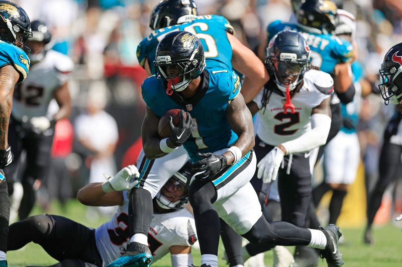 Jacksonville Jaguars running back Travis Etienne (1) scores a rushing touchdown during the fourth quarter of an NFL football matchup at EverBank Stadium, Sunday, Sept. 21, 2025, in Jacksonville, Fla. The Jaguars defeated the Texans 17-10. [Corey Perrine/Florida Times-Union]
