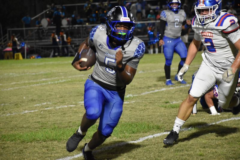 Destin's Junior Harris looks for open ground against the Taylor County Bulldogs. Harris rushed for 99 yards and one touchdown against the Bulldogs.