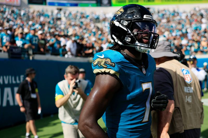 Jacksonville Jaguars wide receiver Brian Thomas Jr. (7) reacts to his catch and run for a first down pick up that would set up a touchdown score during the fourth quarter of an NFL football matchup at EverBank Stadium, Sunday, Sept. 21, 2025, in Jacksonville, Fla. The Jaguars defeated the Texans 17-10. [Corey Perrine/Florida Times-Union]
