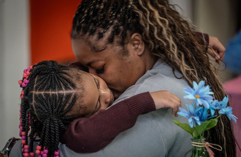 Andrene Long hugs her daughter Vidicarr, 5, as they participated in National Family Day activities at the Grimes Elementary School in Mount Vernon, New York, on Sept. 22, 2025. The holiday is just one of more than a dozen national days honoring family members from sons and daughters to grandparents and pets.