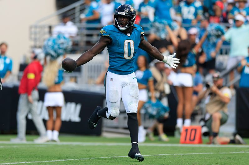 Jacksonville Jaguars linebacker Devin Lloyd (0) reacts to his fumble recovery during the fourth quarter of an NFL football matchup at EverBank Stadium, Sunday, Sept. 21, 2025, in Jacksonville, Fla. The Jaguars defeated the Texans 17-10.