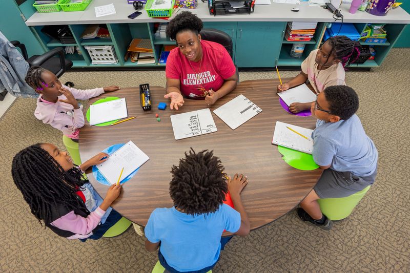 Chyna Lindsay, a paraprofessional at Ruediger Elementary School, works with a small group of students Wednesday, Sept. 17, 2025.