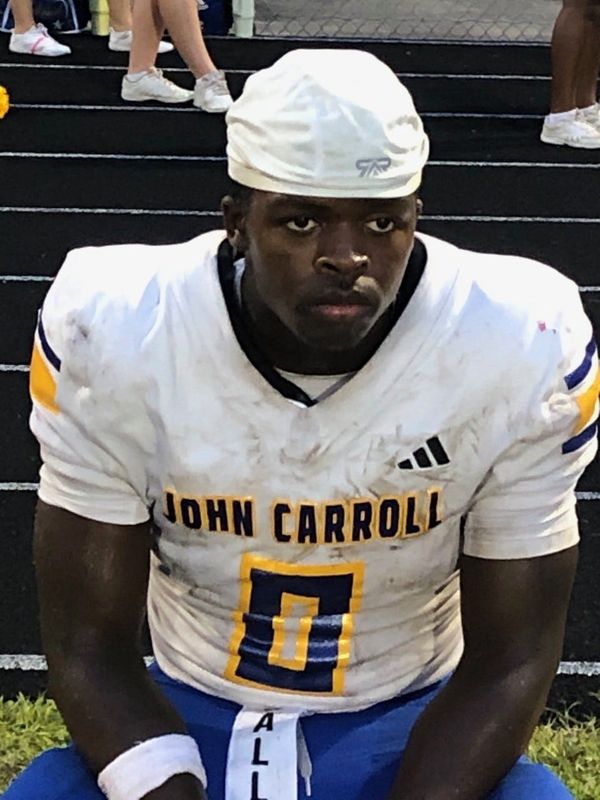 John Carroll running back Jeremy Pittman sits on the sidelines of a blowout win against Forest Hill on Thursday, Sept. 25, 2025.