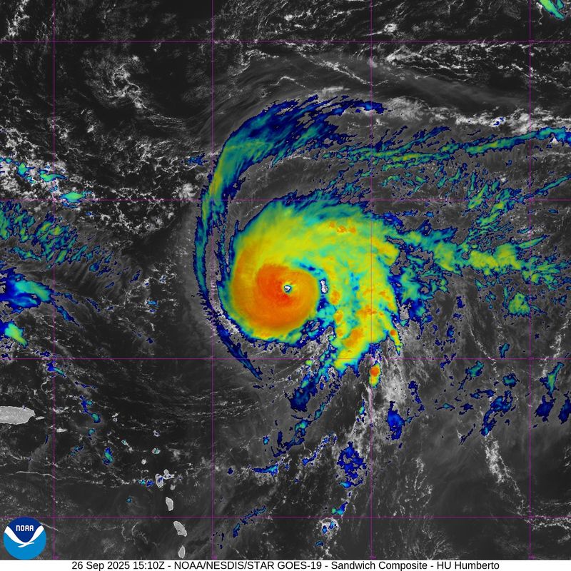 Satellite view of Hurricane Humberto, right, 11 a.m. Sept. 26, 2025. On the left is Invest 94L.