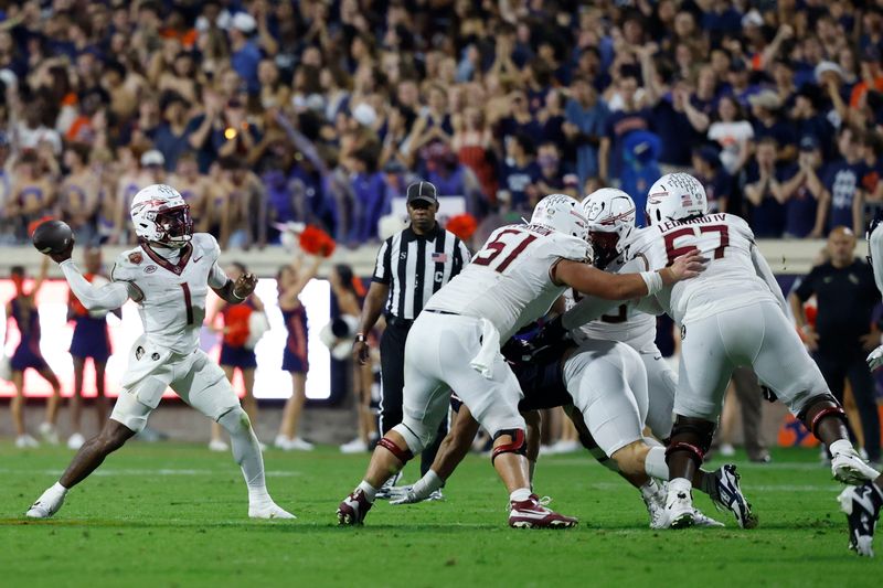 Sep 26, 2025; Charlottesville, Virginia, USA; Florida State Seminoles quarterback Tommy Castellanos (1) passes the ball against the Virginia Cavaliers during the second quarter at Scott Stadium. Mandatory Credit: Geoff Burke-Imagn Images