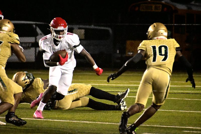 Leon Lions running back Kay'rn Adger looks for a lane to run versus Lincoln Trojans defensive back Zhyon Mainor (19) during a Week 6 FHSAA football game at Gene Cox Stadium in Tallahassee, Florida, Friday, Sept. 26, 2025.