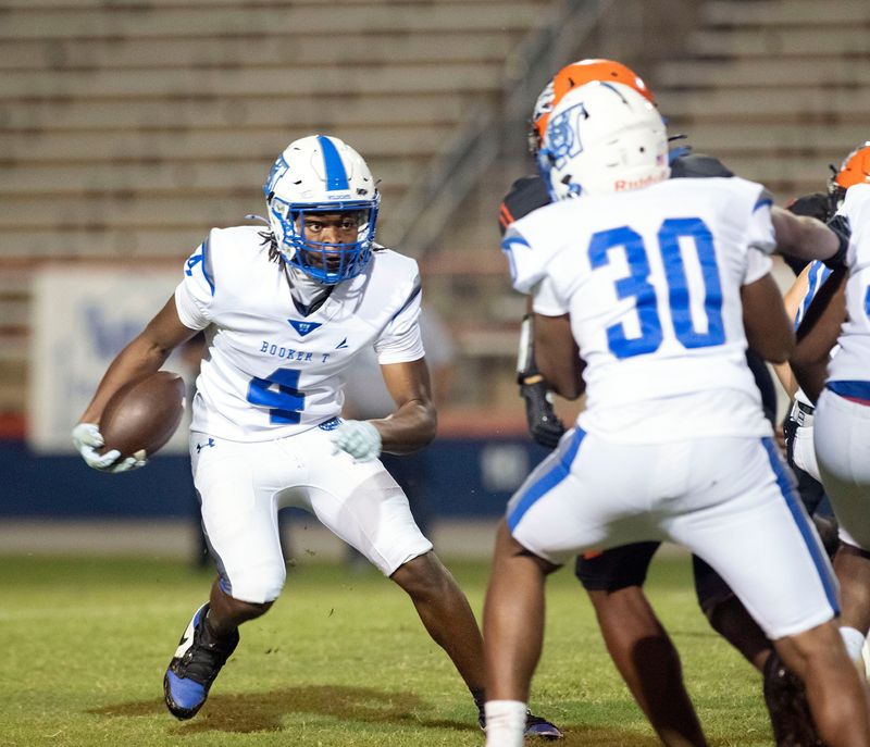 Washington's Kaeden Latten (No. 4) looks for a way to penetrate the Escambia defensive line during Friday night's district game against the Gators.
