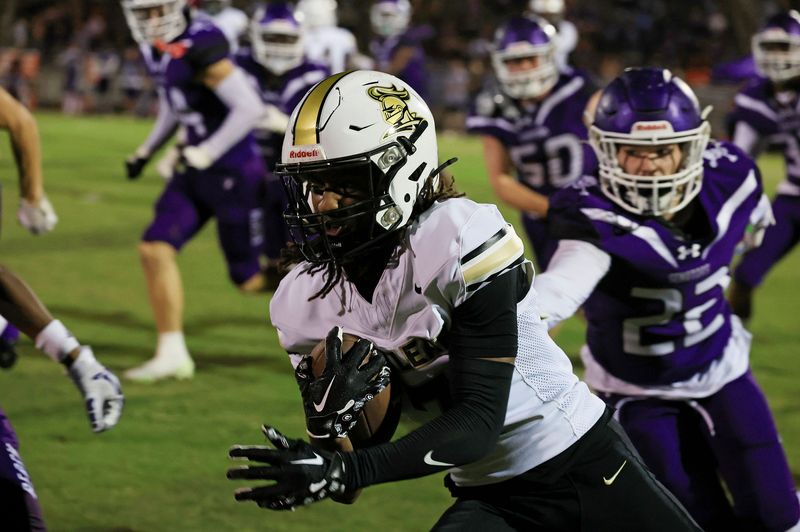 Oakleaf's Trace Burney (7) rushes for yards against Fletcher's Hunter Nevin (22) during the second quarter of a high school football matchup at Jack Taylor Stadium, Friday, Sept. 26, 2025, in Jacksonville Beach, Fla.