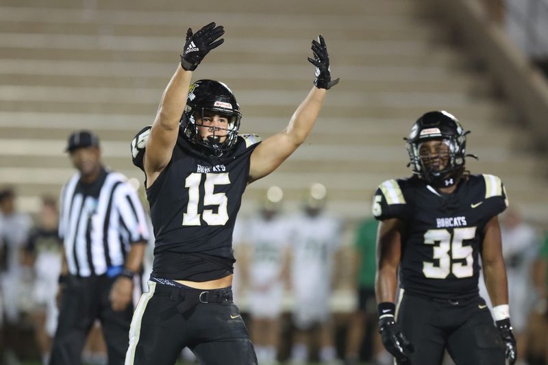 Buchholz Bobcats player Evan Walker (15) gestures to the sidelines during the first half of a football game between Buchholz High School and Nease High School at Citizens Field in Gainesville, FL on Friday, September 26, 2025. [Chris Watkins/Gainesville Sun]