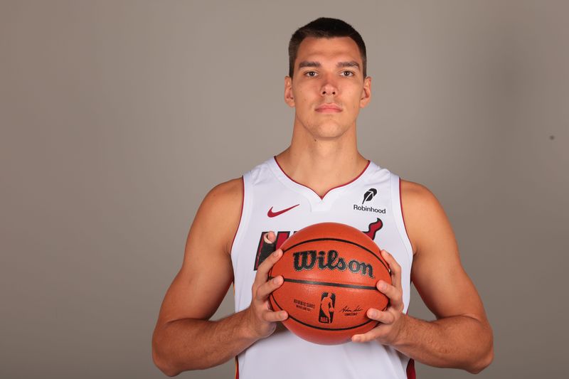 Sep 29, 2025; Miami, FL, USA; Miami Heat center Vladislav Goldin (50) poses for a photo during media day at Kaseya Center. Mandatory Credit: Sam Navarro-Imagn Images