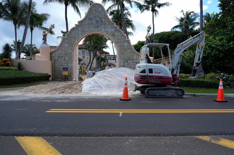 Crews used a small excavator as part of a project to replace driveway pavers at the northeast entrance to President Donald Trump's Mar-a-Lago Club in Palm Beach on Sept. 25.