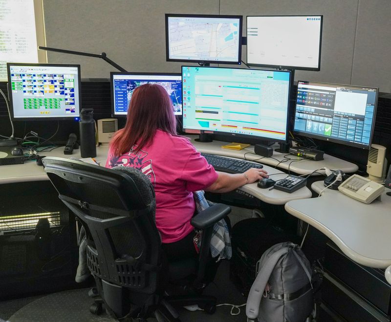 911 call taker Stephanie Allen handles a call at Escambia County's Emergency Operations Center in Pensacola on Oct. 2, 2025. EMS is about to launch a campaign to raise awareness about the improper use of 911.