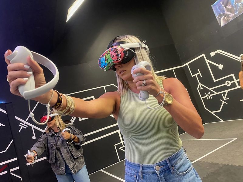 Patrons play a virtual reality game at VR Adventure Zone, a virtual reality entertainment venue moving from Cordova Mall to a space at Pensacola Beach.