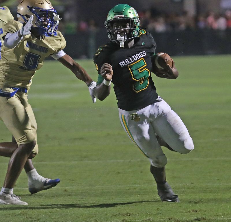 DeLand’s Taihj Moore (5) runs down the field during the game against Mainland high school hosted by DeLand, Friday, Oct. 3, 2025.
