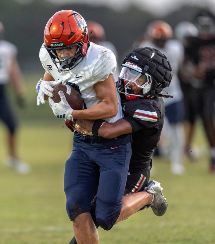 Benjamin wide receiver Julian Luiz catches the ball against Seminole Ridge on October 3, 2025, in Loxahatchee, Florida.