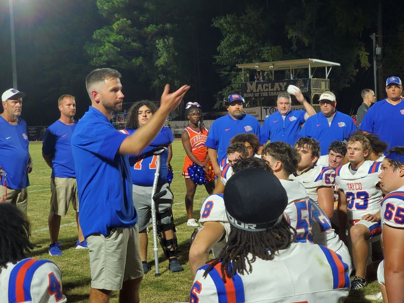 Head coach Jesse Braswell talks to his Taylor County team after their win over Maclay, 41-14, on Friday, Oct. 3, 2025.