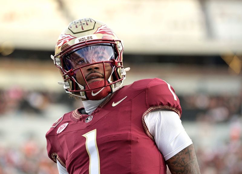 Oct 4, 2025; Tallahassee, Florida, USA; Florida State Seminoles quarterback Tommy Castellanos (1) warms up before a game against the Miami Hurricanes at Doak S. Campbell Stadium. Mandatory Credit: Melina Myers-Imagn Images