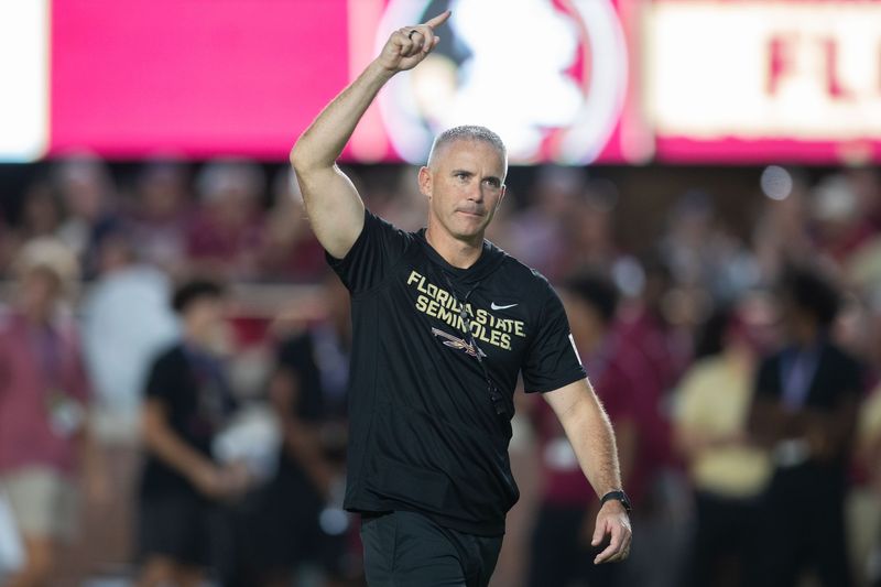 Florida State Seminoles head coach Mike Norvell walks down the field. The Miami Hurricanes lead the Florida State Seminoles 14-3 at the half on Saturday, Oct. 4, 2025.