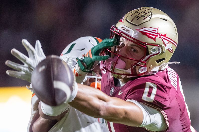 Florida State Seminoles wide receiver Duce Robinson (0) reaches for the ball in the end zone as it sails past his fingertips. The Miami Hurricanes defeated the Florida State Seminoles 28-22 at Doak Campbell Stadium on Saturday, Oct. 4, 2025.