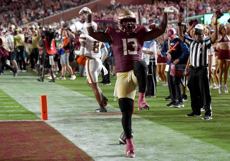 Oct 4, 2025; Tallahassee, Florida, USA; Florida State Seminoles tight end Randy Pittman Jr. (13) celebrates after scoring a touchdown during the second half against the Miami Hurricanes at Doak S. Campbell Stadium. Mandatory Credit: Robert Myers-Imagn Images