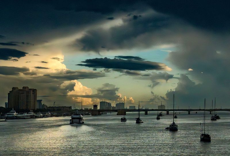 Boats moored in the Lake Worth Lagoon between the Town of Palm Beach and West Palm Beach on a rainy Wednesday morning June 25, 2025.