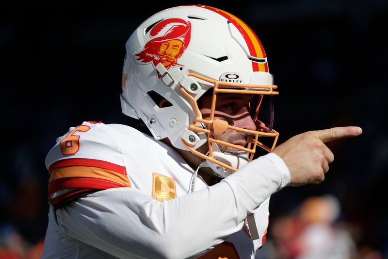 Oct 5, 2025; Seattle, Washington, USA; Tampa Bay quarterback Baker Mayfield (6) wearing the Buccaneers throwback helmets as he warms ups prior to a game against the Seattle Seahawks at Lumen Field. Mandatory Credit: Joe Nicholson-Imagn Images