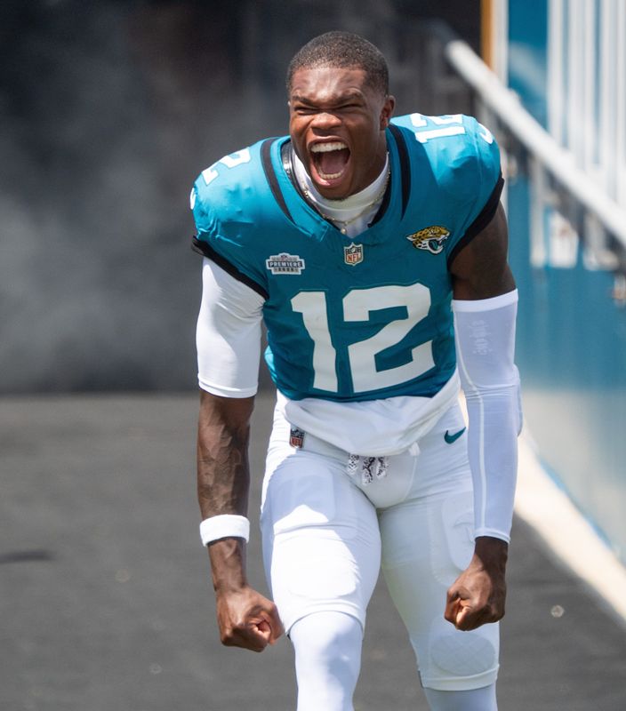 Jacksonville Jaguars wide receiver Travis Hunter (12) screams as he comes out of the tunnel before the start of an NFL football game between the Carolina Panthers at Jacksonville Jaguars at EverBank Stadium Sunday September 7, 2025.