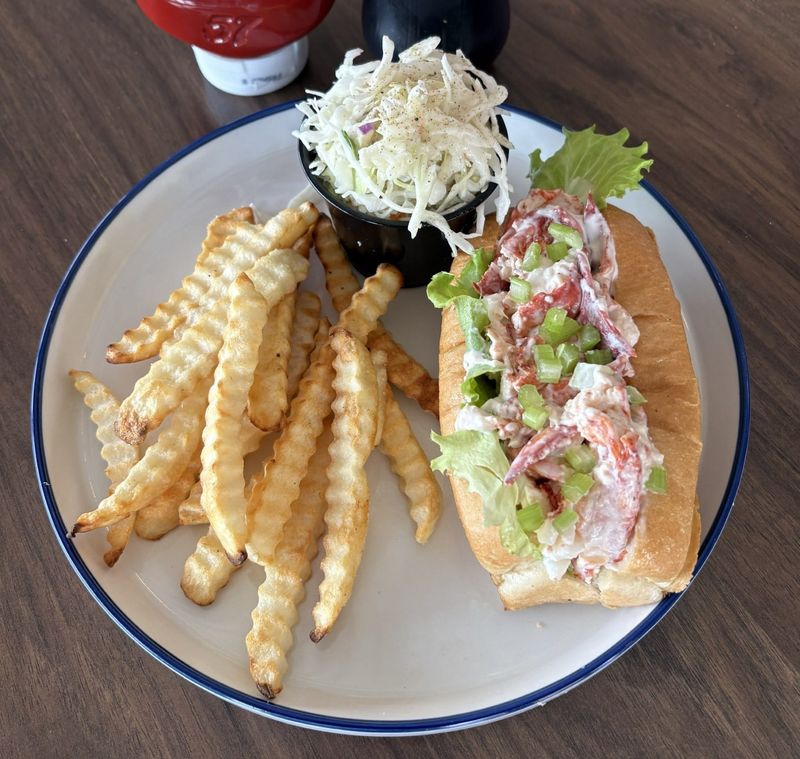 The signature New England Lobster Salad Roll with French fries and coleslaw at The Boston Seafood Company, which recently opened at 120 Durbin Pavilion Drive, Suite D-101, in the sprawling Pavilion at Durbin Park retail center in Saint Johns.
