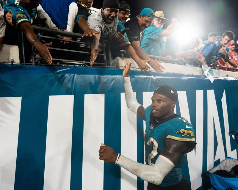 Jacksonville Jaguars cornerback Jourdan Lewis (2) gives high-fives to fans after the Jaguars defeated the Chiefs 31-28 during a Monday Night NFL football game at EverBank Stadium, Monday, Oct. 6, 2025, in Jacksonville, Fla. [Doug EngleFlorida Times-Union]