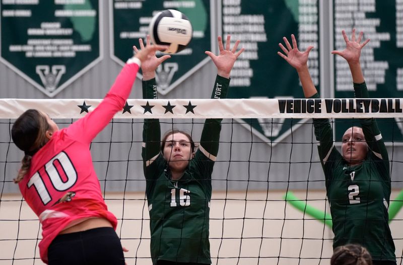 Mooney’s Abby Johnson (#10) hits against Venice’s Kinsey Judge (#16) and Marley Payne (#2). The Venice Indians hosted the Cardinal Mooney Cougars in girls volleyball Tuesday evening, Oct. 7, 2025. The Indians won the match 3-0.
