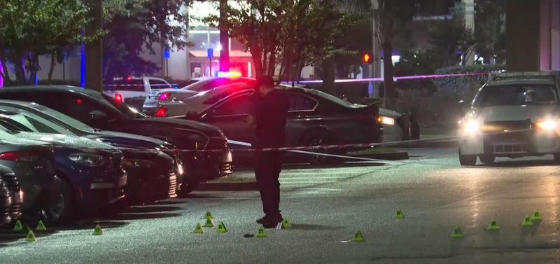 Multiple evidence markers show shell casings outside Whispers Oysters & Crabhouse on Philips Highway where a man was killed Oct. 4 in Jacksonville.