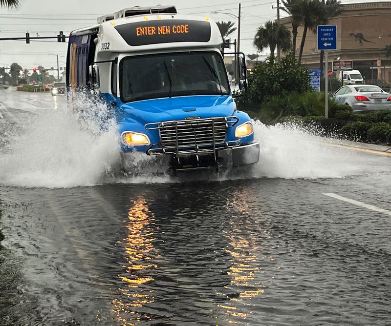 Heavy rains throughout the night and on Friday October 10 flooded streets in Brevard. Also the lagoon is extremely high. A bus makes its way west on a flooded 520 in Cocoa Beach.