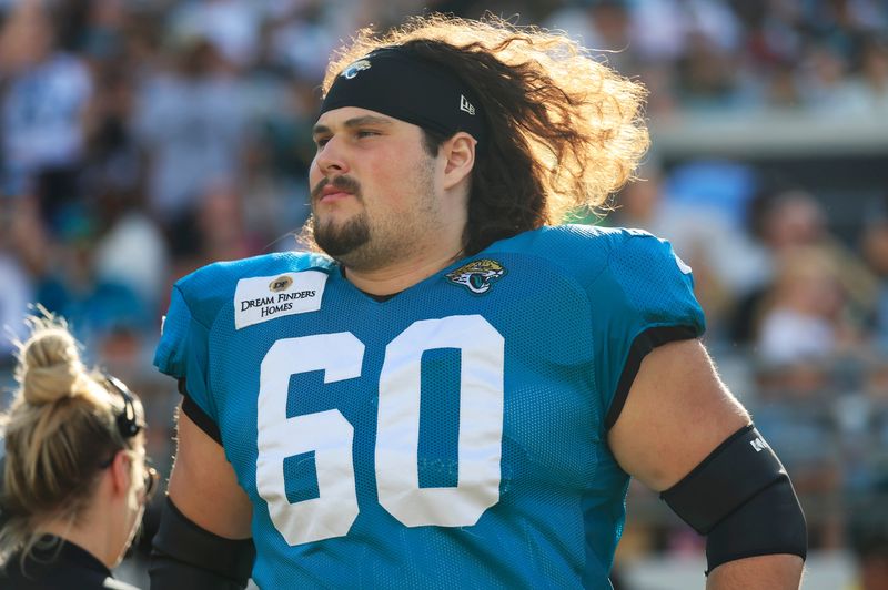 Jacksonville Jaguars center Jonah Monheim (60) runs on the field during an NFL scrimmage event at EverBank Stadium, Friday, Aug. 1, 2025, in Jacksonville, Fla. [Corey Perrine/Florida Times-Union]