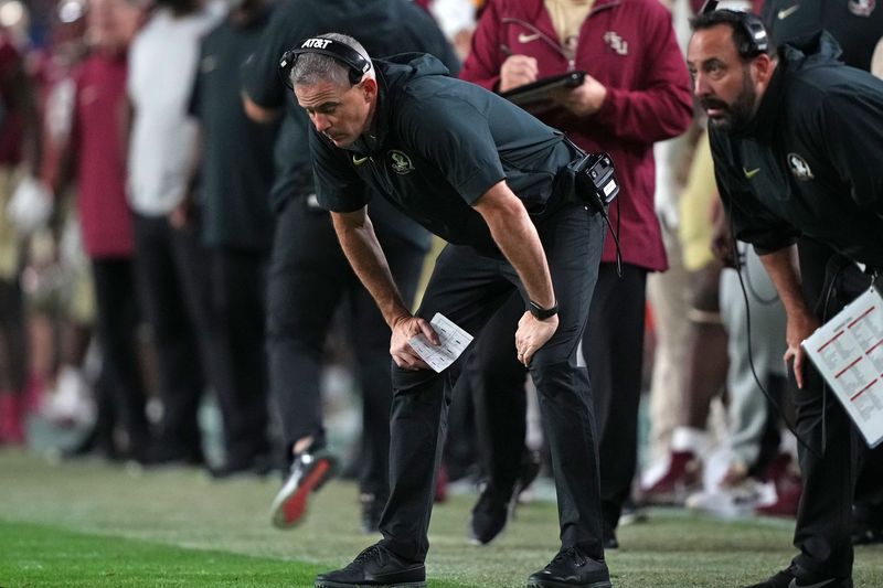 Dec 30, 2023; Miami Gardens, FL, USA; Florida State Seminoles head coach Mike Norvell reacts against the Georgia Bulldogs during the second half in the 2023 Orange Bowl at Hard Rock Stadium. Mandatory Credit: Jasen Vinlove-USA TODAY Sports