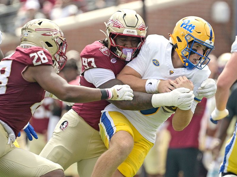 Oct 11, 2025; Tallahassee, Florida, USA; Florida State Seminoles defensive lineman Mandrell Desir (93) sacks Pittsburgh Panthers quarterback Mason Heintschel (6) during the first half at Doak S. Campbell Stadium. Mandatory Credit: Melina Myers-Imagn Images