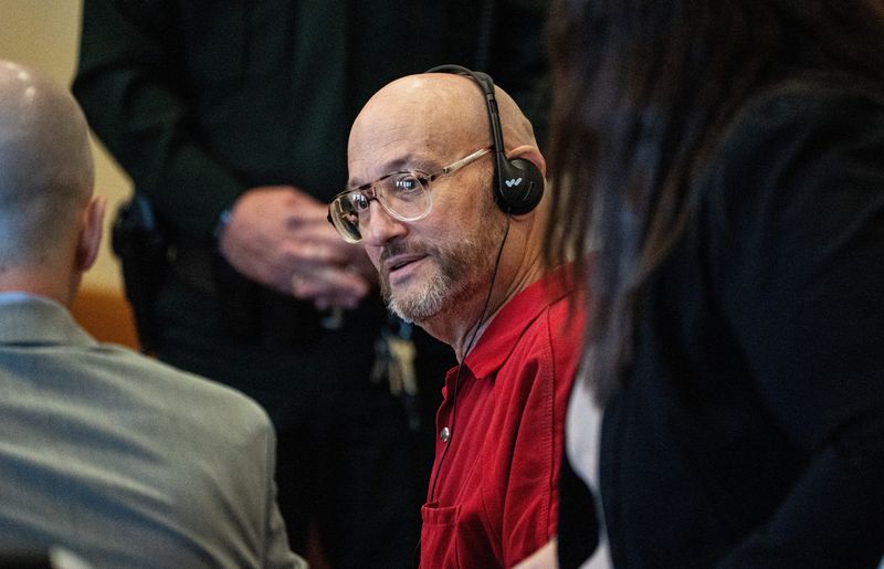 Mark Sievers confers with members of his legal team at the Lee County courthouse on Monday, Oct. 13, 2025. He is appealing his conviction and his death sentence for the murder of his wife,Teresa Sievers.