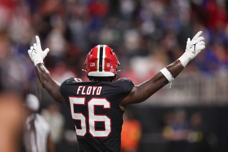 Oct 13, 2025; Atlanta, Georgia, USA; Atlanta Falcons defensive end Leonard Floyd (56) reacts after an interception during the second half of a game against the Buffalo Bills at Mercedes-Benz Stadium. Mandatory Credit: Brett Davis-Imagn Images