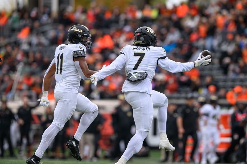 Wake Forest Demon Deacons defensive lineman Nuer Gatkuoth (7) celebrates an interception against the Oregon State Beavers during the second quarter at Reser Stadium.