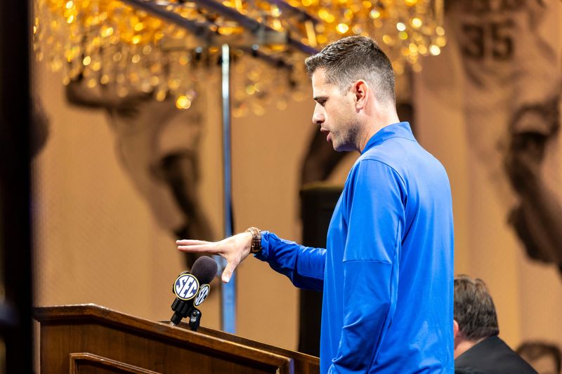 Oct 15, 2025; Birmingham, AL, USA; Florida Gators head coach Todd Golden talks with the media during SEC Media Days at Grand Bohemian Hotel. Mandatory Credit: Vasha Hunt-Imagn Images