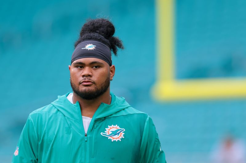 Miami Dolphins guard Jonah Savaiinaea looks on before the game against the Jacksonville Jaguars at Hard Rock Stadium.