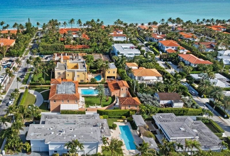 In the foreground with the gray roofs, a house at 150 Dunbar Road, left, and a smaller house at 151 Atlantic Ave., right, have changed hands in simultaneous transactions for a combined $25 million. Designed as a compound, the properties had not been sold since the late 1990s.