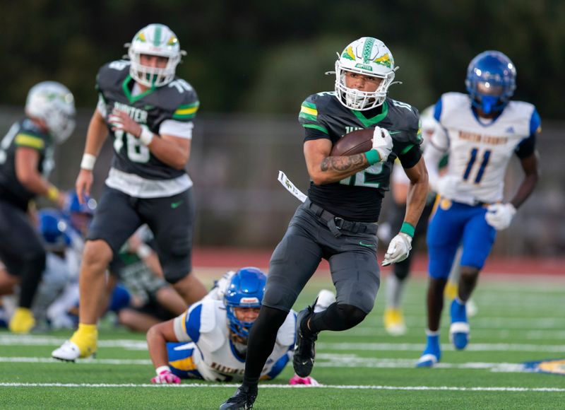 Jupiter running back Jayden Roberts takes off for a touchdown against Martin County on October, 17, 2025, in Jupiter, Florida.