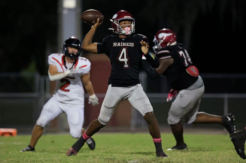 Raines' Timothy Cole (4) looks to pass during the second quarter of a high school football matchup at Raines High School, Friday, Oct. 17, 2025, in Jacksonville, Fla. The Raines Vikings crusied past the Creekside Knights 52-3.