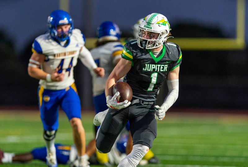 Jupiter's Nick Bothe runs the ball against Martin County on October, 17, 2025, in Jupiter, Florida.