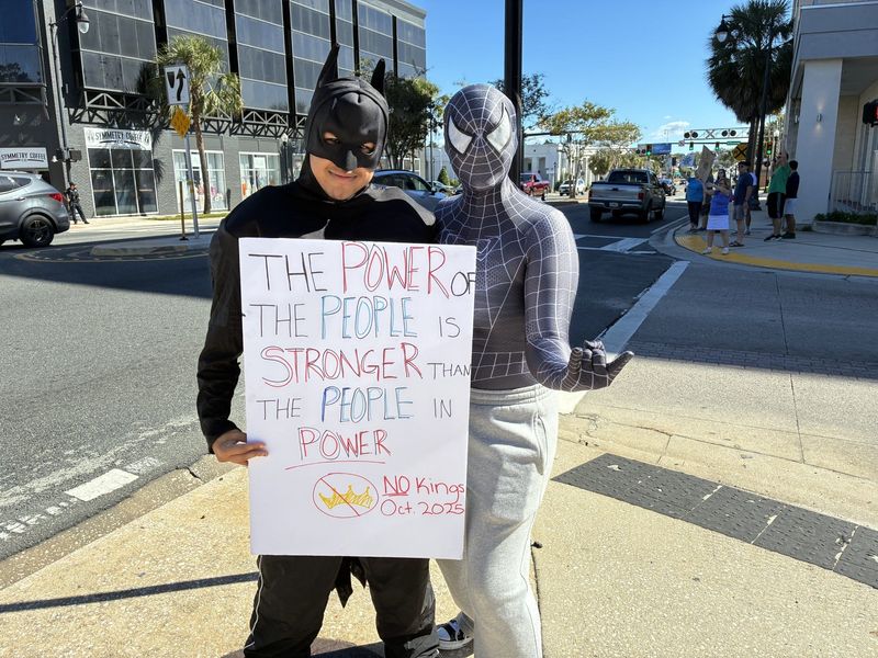 People dressed as Batman and Spiderman were among those in attendance Oct. 18, 2025 at the No Kings rally protesting the Trump administration. The rally was held on the downtown square in Ocala.