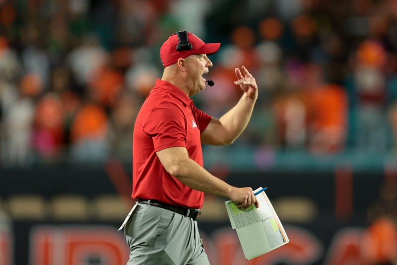 Oct 17, 2025; Miami Gardens, Florida, USA; Louisville Cardinals head coach Jeff Brohm reacts on the sideline against the Miami Hurricanes during the fourth quarter at Hard Rock Stadium. Mandatory Credit: Sam Navarro-Imagn Images
