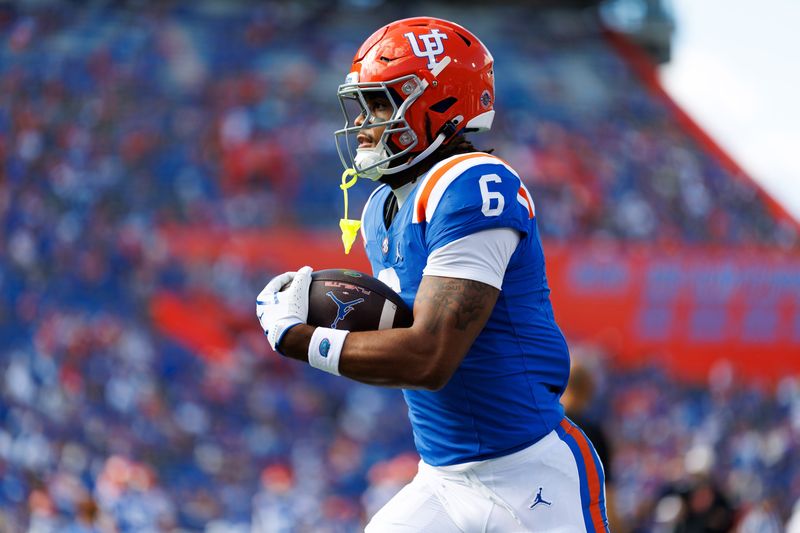 Oct 18, 2025; Gainesville, Florida, USA; Florida Gators wide receiver Dallas Wilson (6) runs with the ball before a game against the Mississippi State Bulldogs at Ben Hill Griffin Stadium. Mandatory Credit: Matt Pendleton-Imagn Images