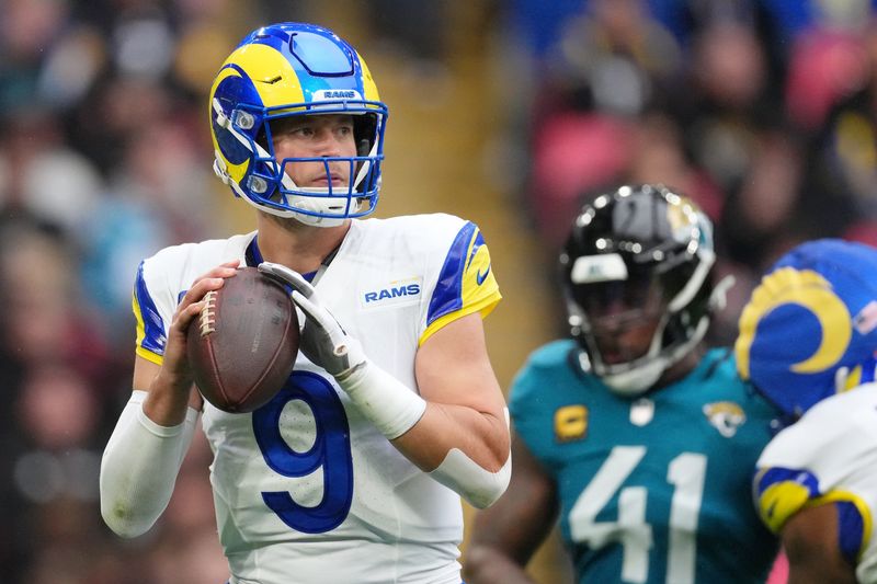 Oct 19, 2025; London, United Kingdom; Los Angeles Rams quarterback Matthew Stafford (9) looks to pass the ball against the Jacksonville Jaguars during the first half of an NFL International Series game at Wembley Stadium. Mandatory Credit: Kirby Lee-Imagn Images