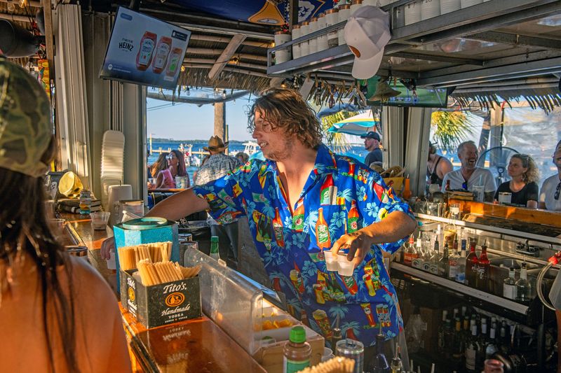 Bartender Austin Lopex serves drinks at the Sneaky Tiki Bar, a hidden gem located inside the Pensacola Beach RV Resort. Due to a recent change by the SRIA, Sneaky Tiki will now have the option to extend its operating season.